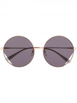 Солнцезащитные очки в круглой оправе Moschino Eyewear. Цвет: золотистый